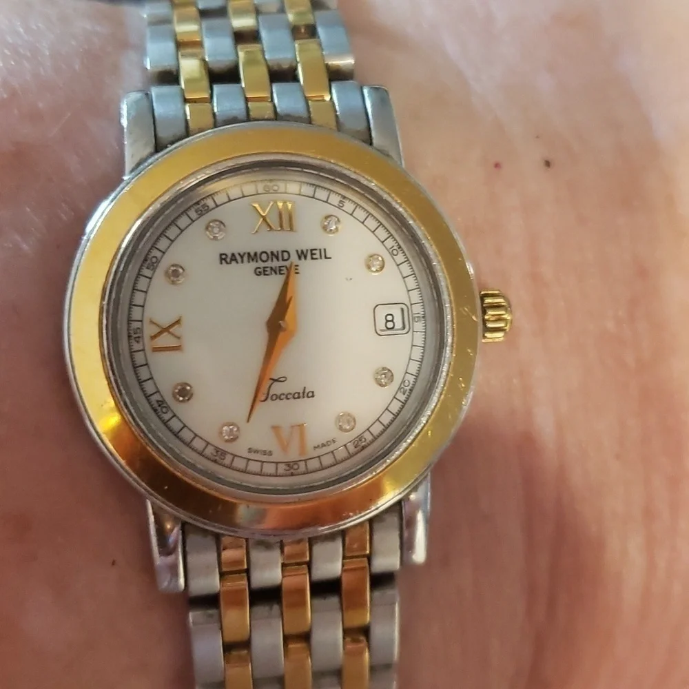 Raymond  Weil Toccata woman's watch with pearl face and Diamond accents.